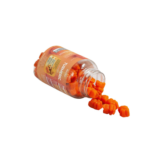 Orange earplugs spilling out of a transparent jar on a white background